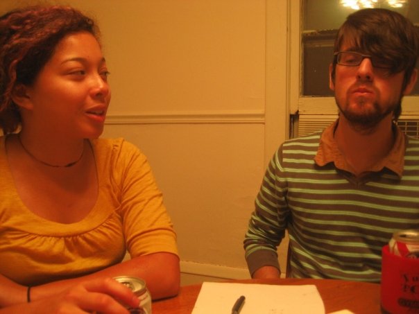 Bryce and Daniella playing boardgames and drinking PBR