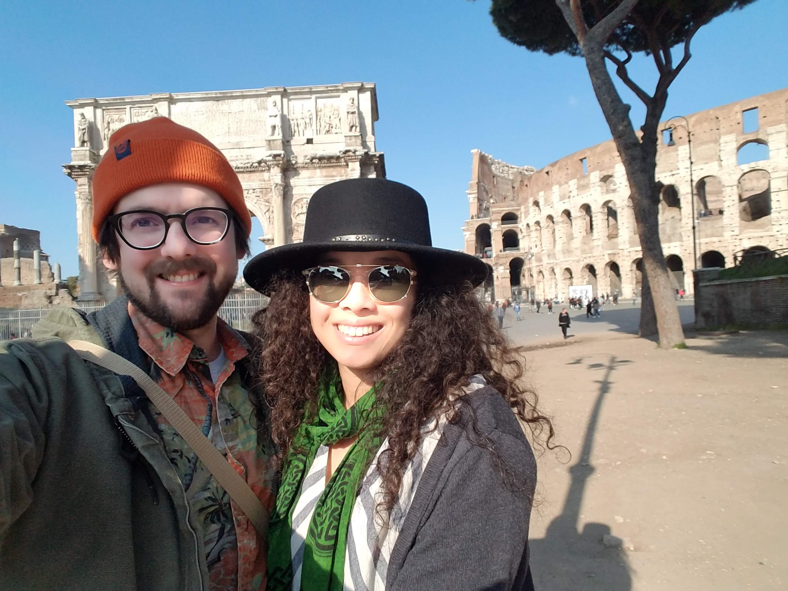Bryce and Daniella standing next to the Colloseum