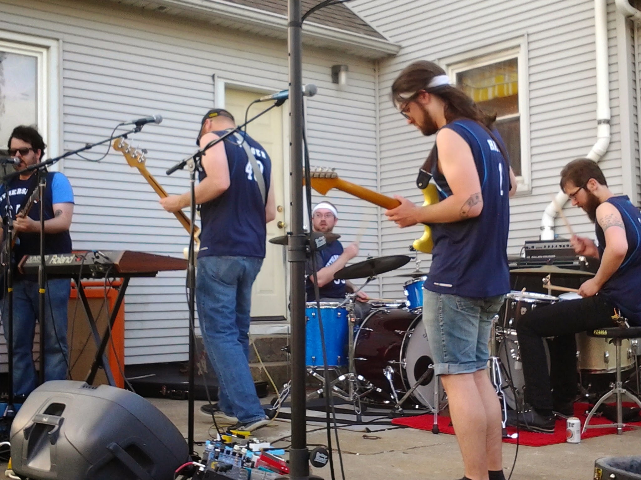 Bryce playing guitar with his band, Withershins